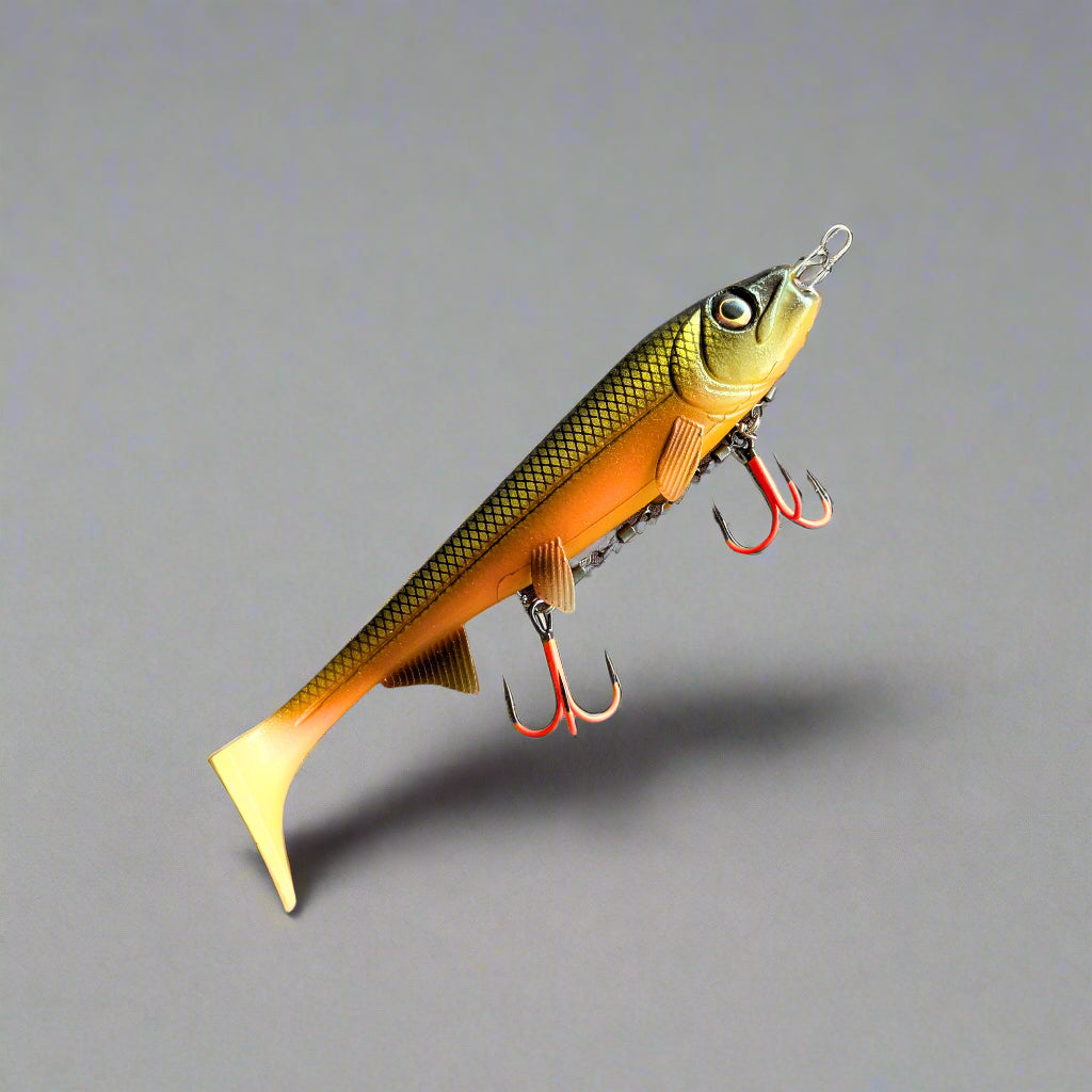 Fishing lure with multiple hooks on a gray surface