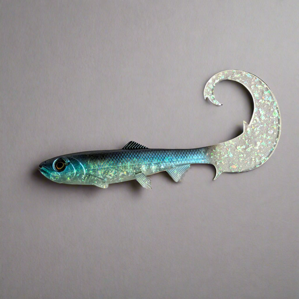 Overview of glittery blue fishing lure with curl tail