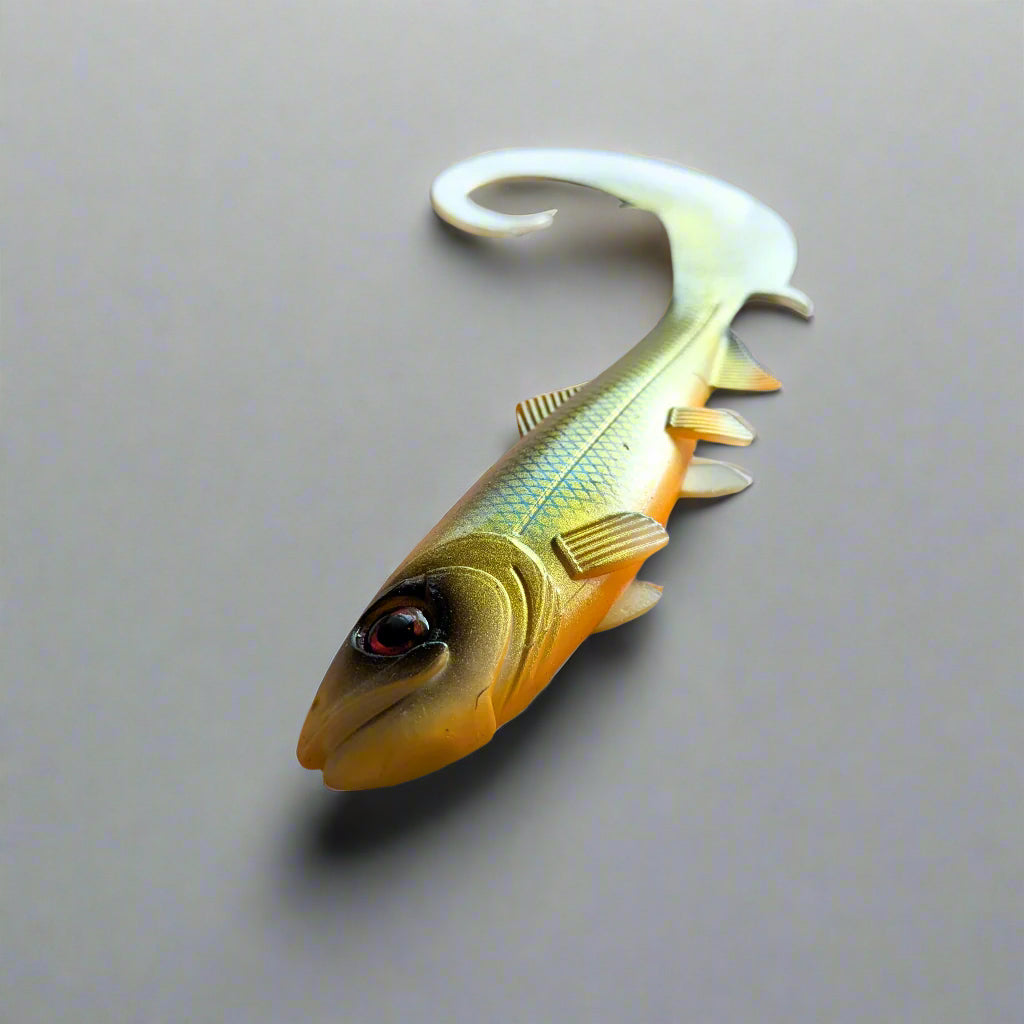 Fishing lure gold and white colour with curl tail