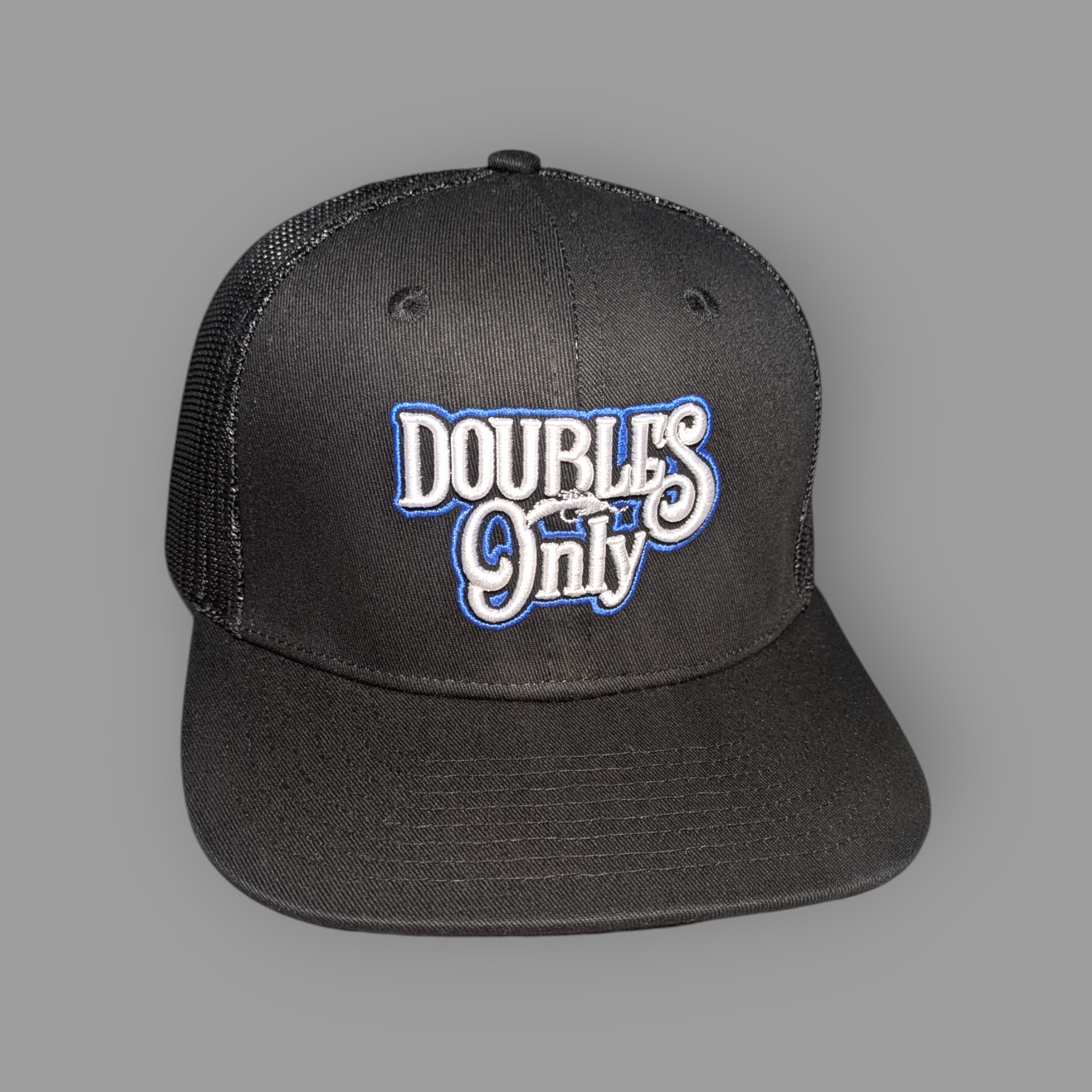 Black cap with 'Doubles Only' text on a gray background