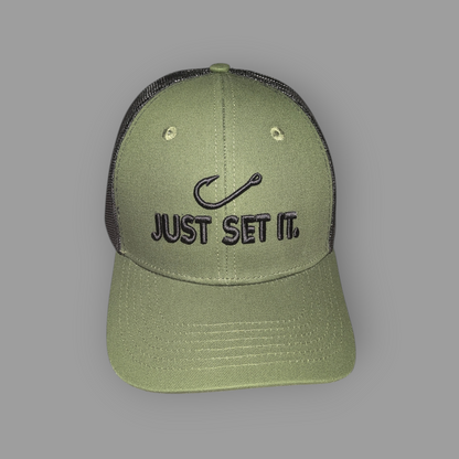 Green cap with 'Just Set It' text and fish hook symbol on a gray background