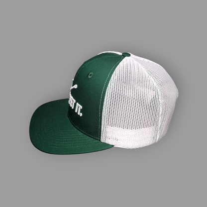 Green and white cap on a gray background