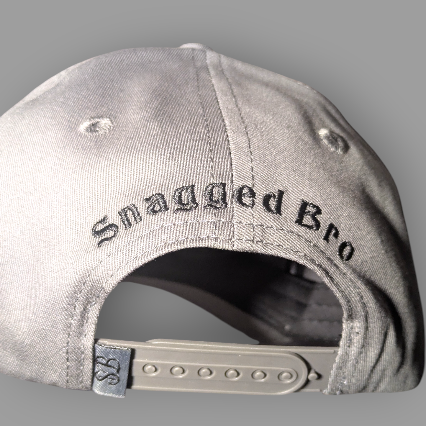 Gray cap with 'Snagged Bro' text on a gray background
