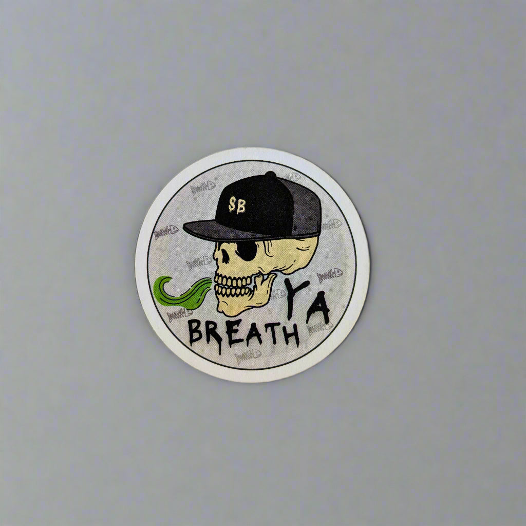 Circular sticker with a skull wearing a cap and text on a white background